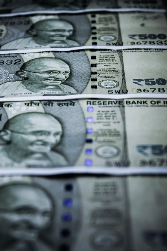 Close-up of Indian 500 rupee banknotes featuring Gandhis portrait. Selective focus.